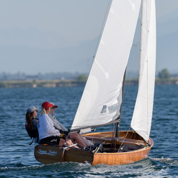Sugar Sugar under full sail, name visible on stern